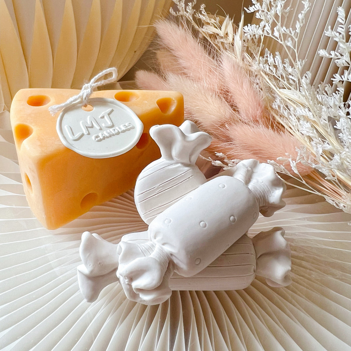 Candy Car Air Freshener, LMJ Candles offers a range of handmade scented air fresheners, featuring car vent clips, hanging diffusers, scented fridge magnets, aroma stone diffusers and decorative artworks.