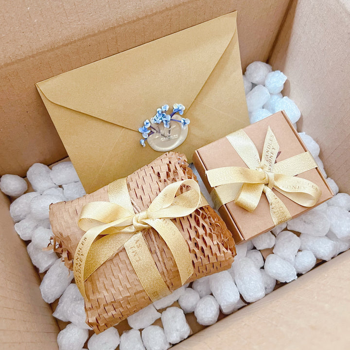 LMJ Candles' Gift Wrapping service, biodegradable packaging with gift ribbons and gift card in envelope 