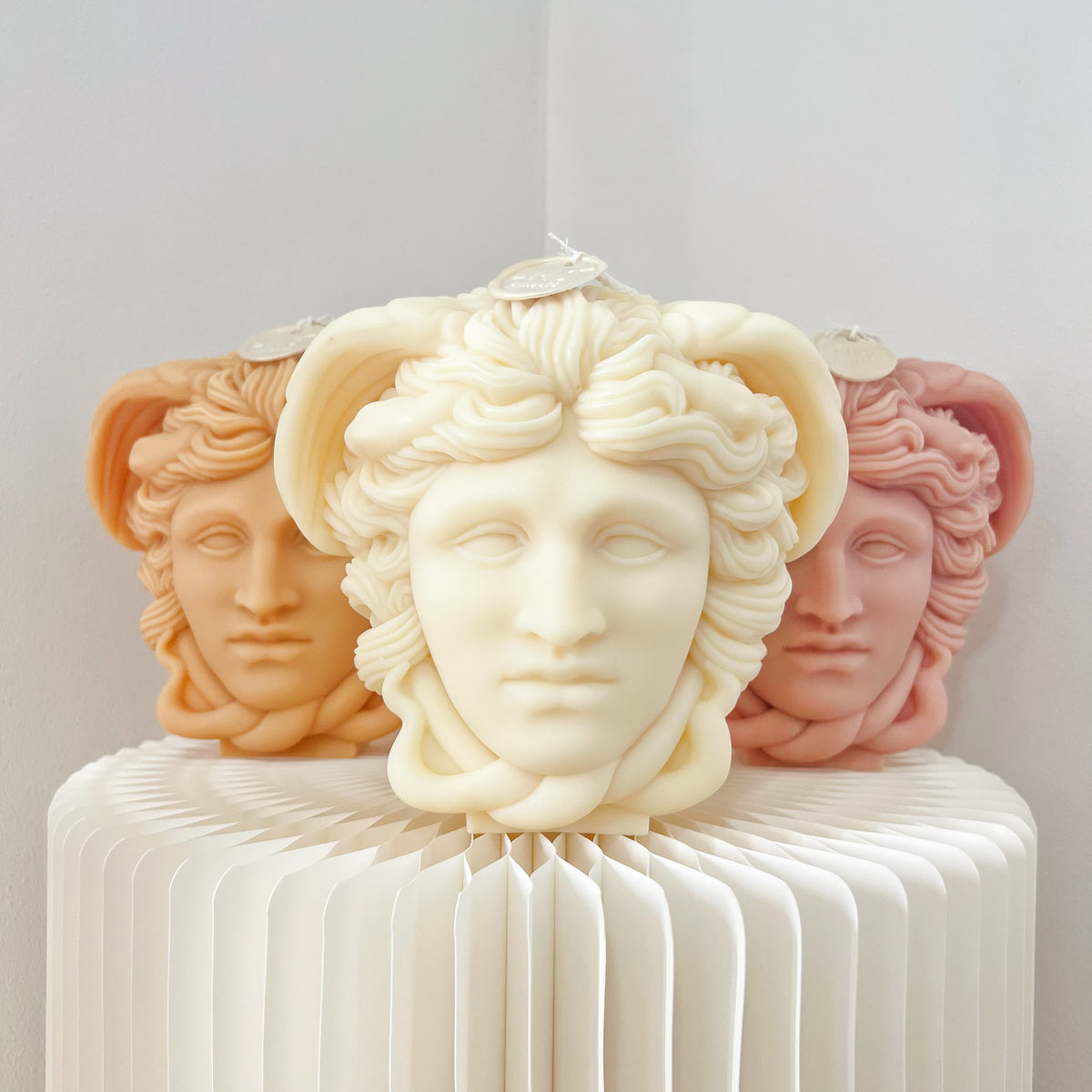 Handmade soy wax body-shaped candles in various sizes and textures, including a Medusa bust, female torso, and self-love candle, for unique home décor | LMJ Candles.